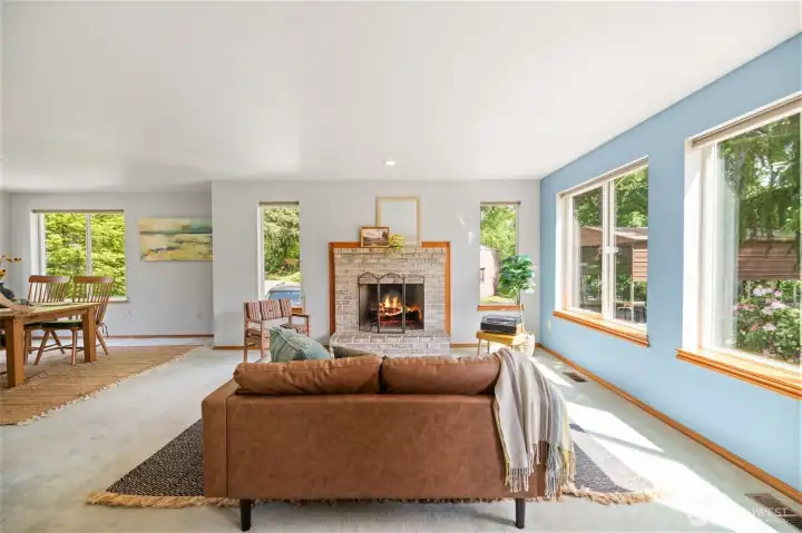 Extra large traditional layout with a wood burning brick fireplace and windows viewing your private and secluded acreage property.