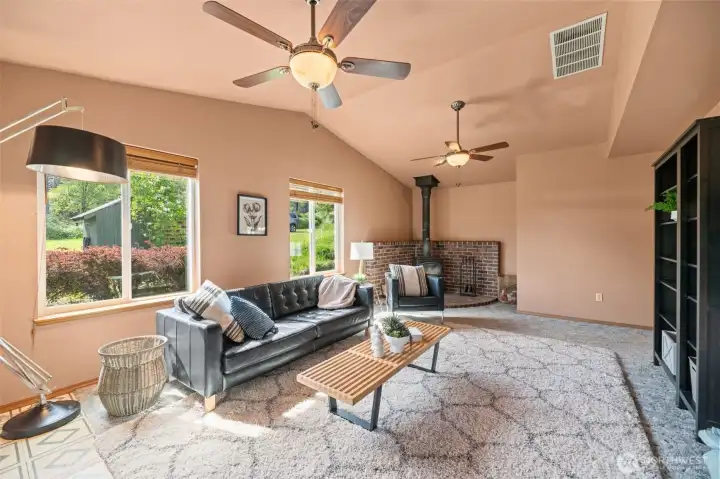 Wood burning stove in the family room off the entertaining deck. Beautiful vaulted ceiling to enjoy sunsets on the southwestern side of the home.
