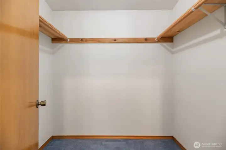 Primary bedroom walk in closet