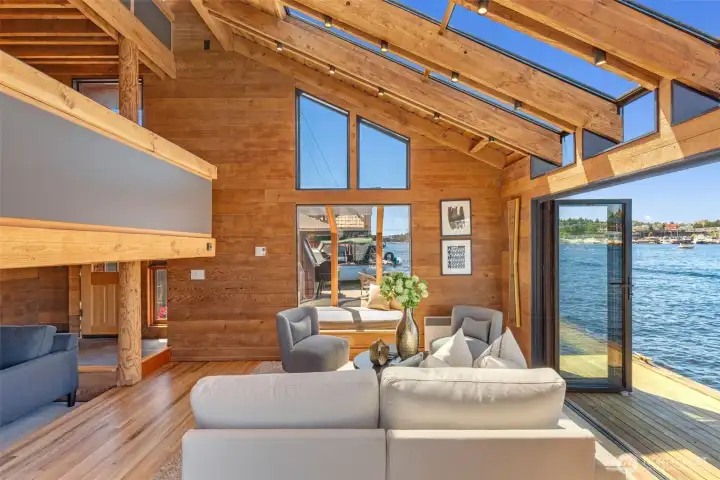 Impressive dramatic roofline with tons of windows, great natural light, and a sliding glass wall!