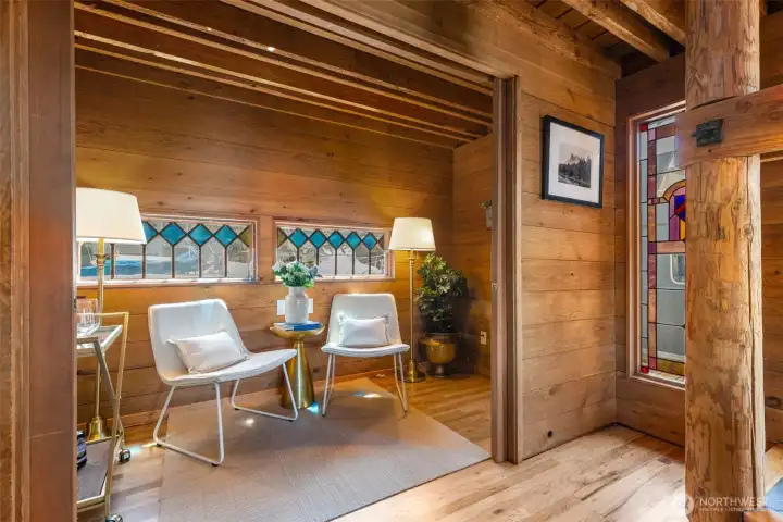 Main floor room with sliding doors would make a great library or office.