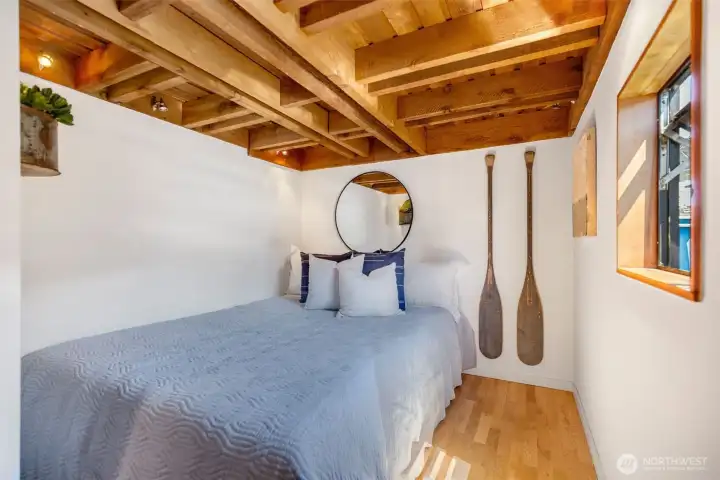 Second main floor bedroom with queen-size bed.