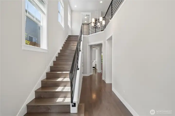 Two-story entry with lots of windows and natural light make for a great homecoming!