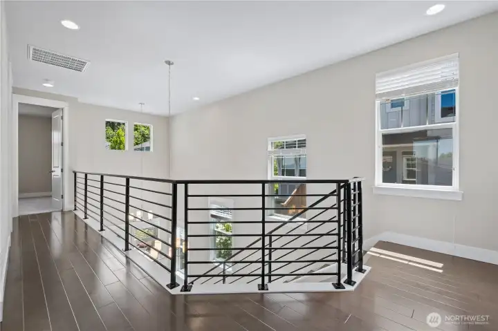 Up the beautiful stairwell showing off so much light and space.