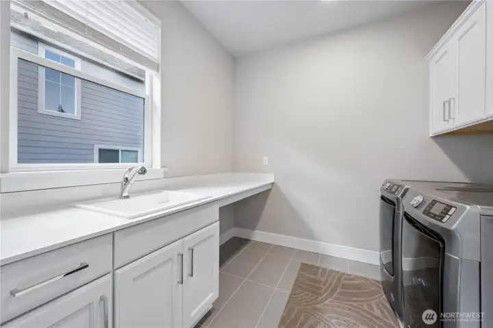 Spacious laundry properly located