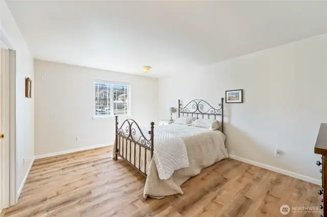 Primary bedroom with connected bathroom and walk in closet