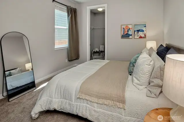 Main floor guest suite with 3/4 bath and walk in closet