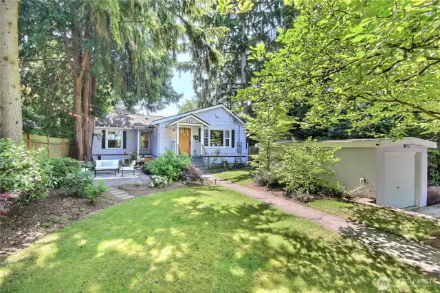 Huge and flat front yard sitting way off the street for ample use and privacy