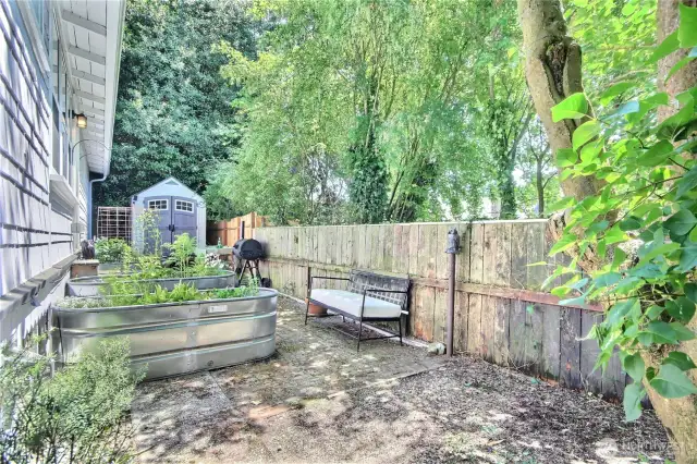 Get a head start on veggies and berries in these irrigated planter boxes, plus yard shed all included!