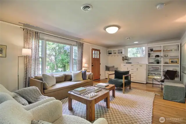 Vaulted ceilings, lots of natural light from updated windows and built in shelving and cabinets at entry!