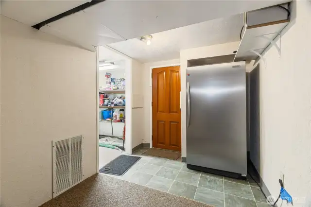 extra fridge lower level next to utility room
