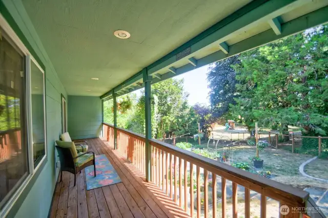 Back deck is covered and overlooks the property.