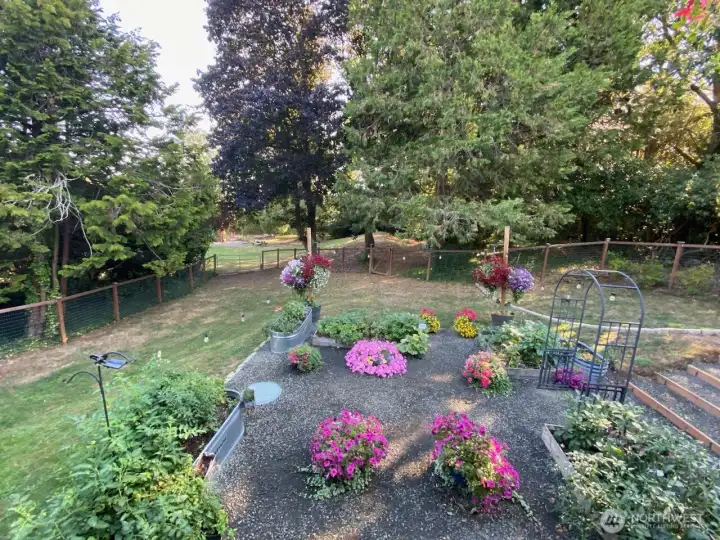 Fenced back yard space and room for pets.  Additional acreage and park like setting is beyond the fencerd area
