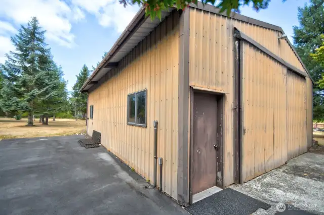 Generous shop with 10-ft doors and RV parking alongside.