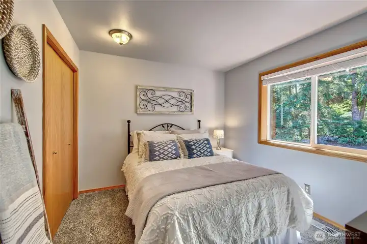 Guest bedroom 1, located near the guest bathroom.