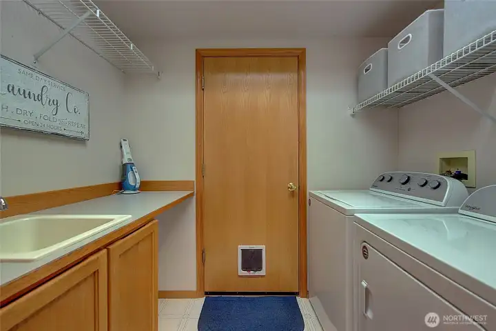 Utility room is located on the main floor with access to the 3-car garage.