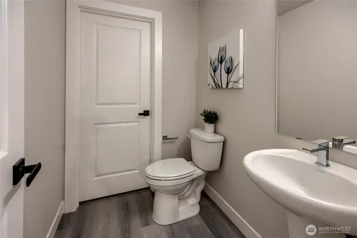 bathroom located conveniently near  (photos from model home)living room