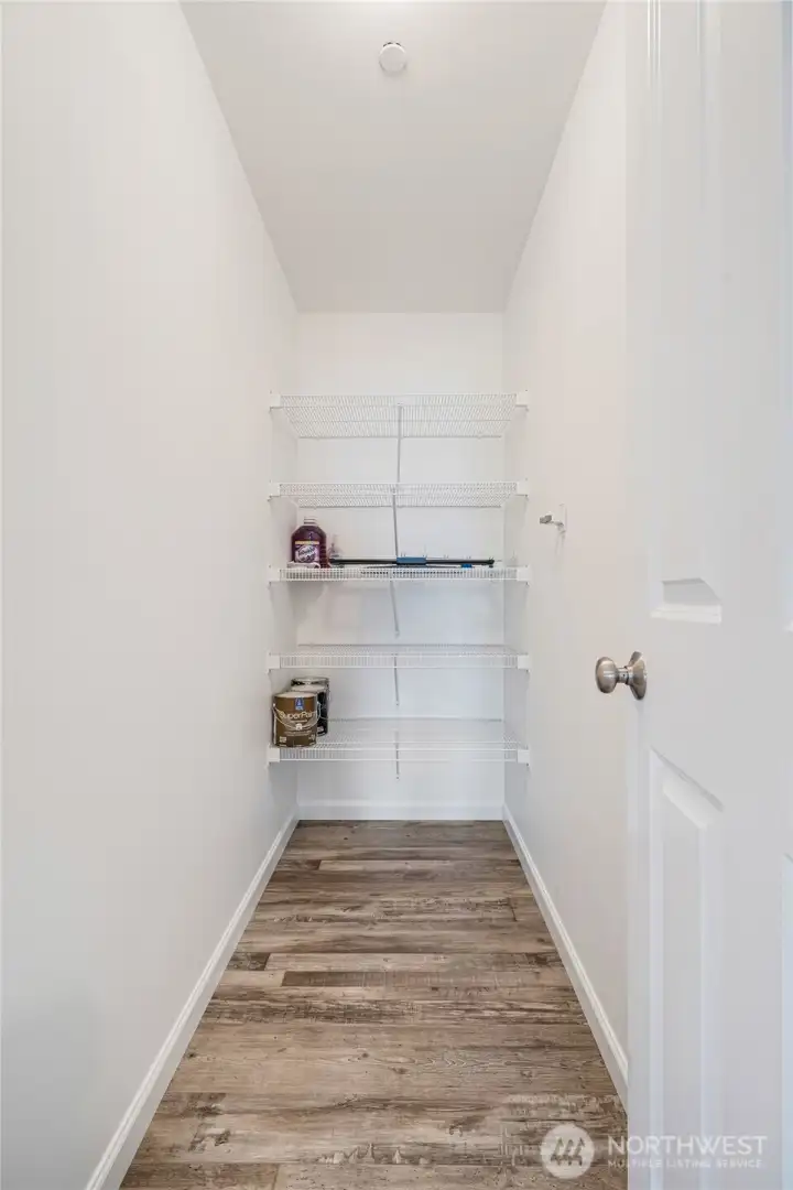 The pantry is a deep storage room off the kitchen.