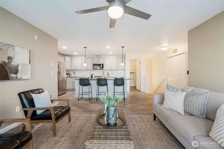 Looking toward the kitchen with the large eating bar for additional seating.