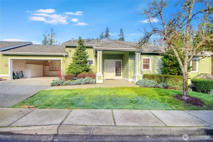 2-car attached garage with epoxy flooring   and custom cabinets