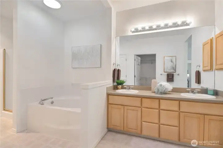 Primary bath with soaking tub and step in shower