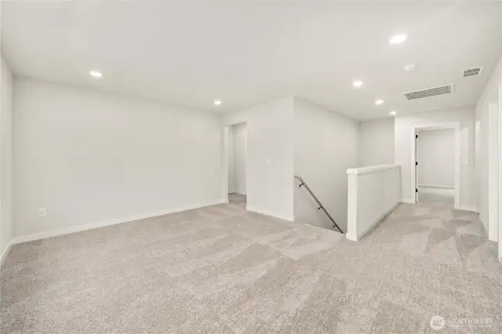 Upstairs loft area. Photos of a previously completed home. Actual colors and finishes may vary. See site agent for details.