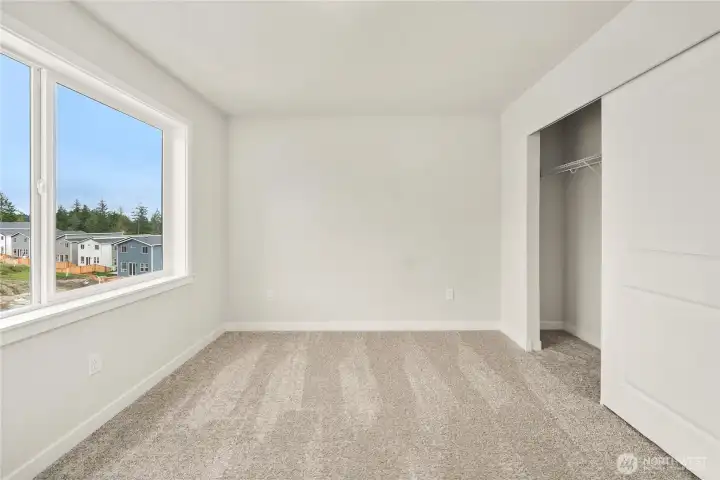 Bed 2. Photos of a previously completed home. Actual colors and finishes may vary. See site agent for details.