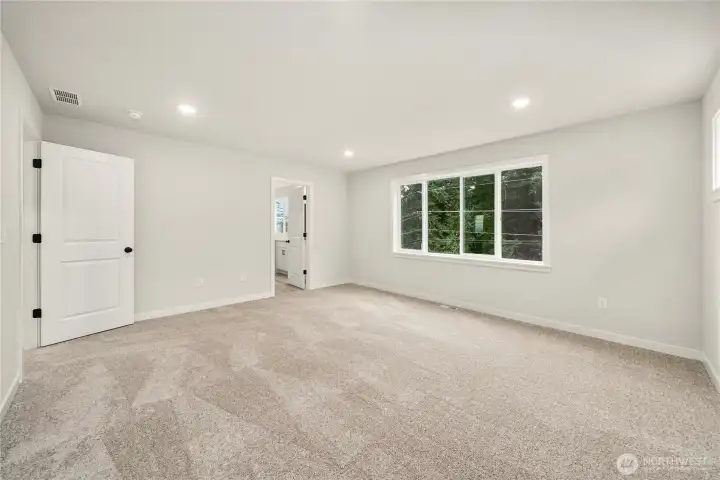 Primary bedroom. Photos of a previously completed home. Actual colors and finishes may vary. See site agent for details.