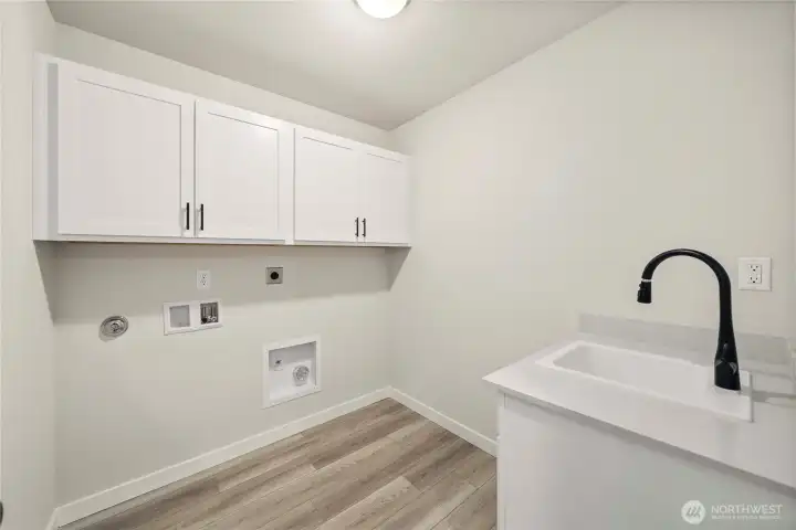 Laundry room. Photos of a previously completed home. Actual colors and finishes may vary. See site agent for details.