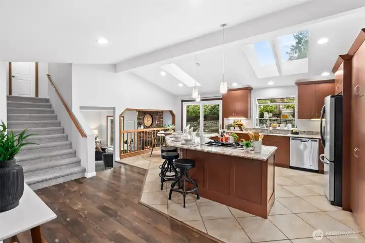 Open concept kitchen with vaulted ceilings.