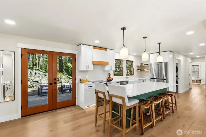 Fully updated island kitchen with quartz countertops and modern finishes.