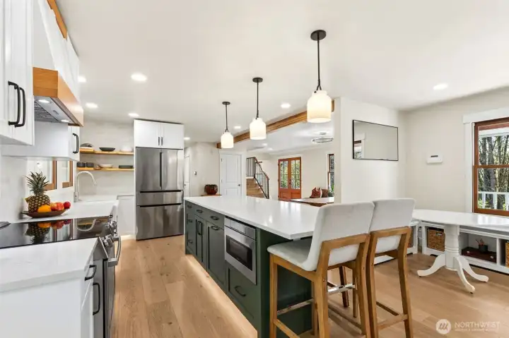 Island kitchen with stylish fixtures and modern design.