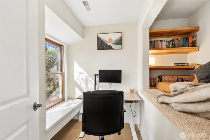 Walk-in closet currently configured as an office nook, with easy conversion back.