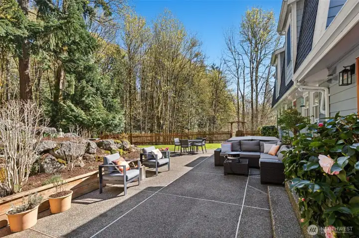 The backyard offers a retreat-like setting surrounded by nature.