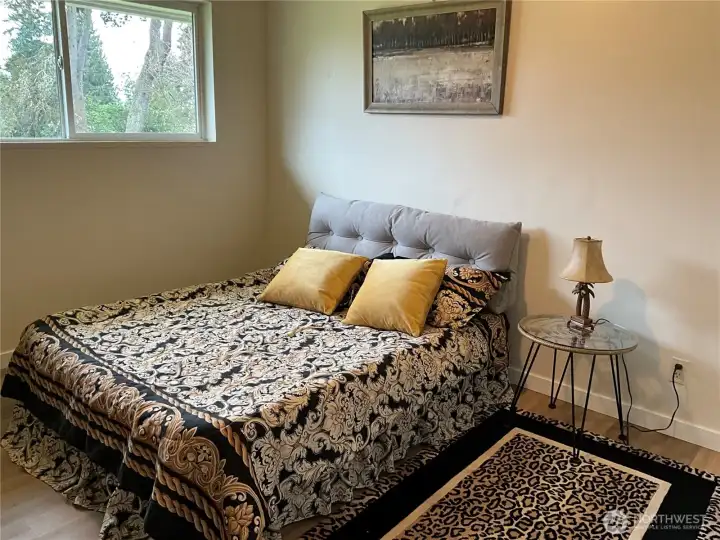 Master bedroom in Unit 1 with half bath