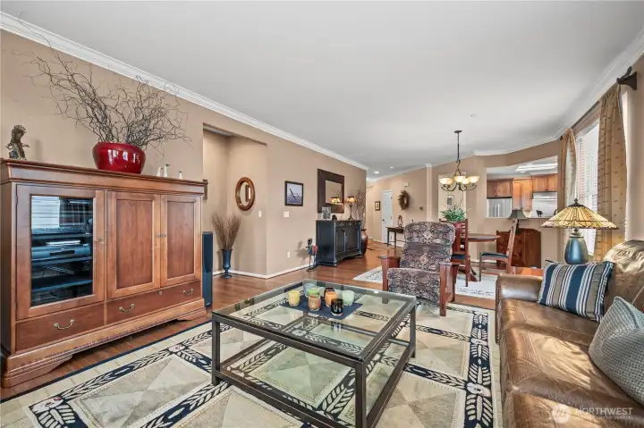 The view back toward the dining area, kitchen, and entry hall.
