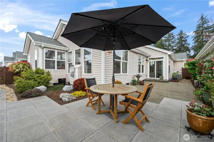 Expanded patio offers space for entertaining and low-maintenance gardening.