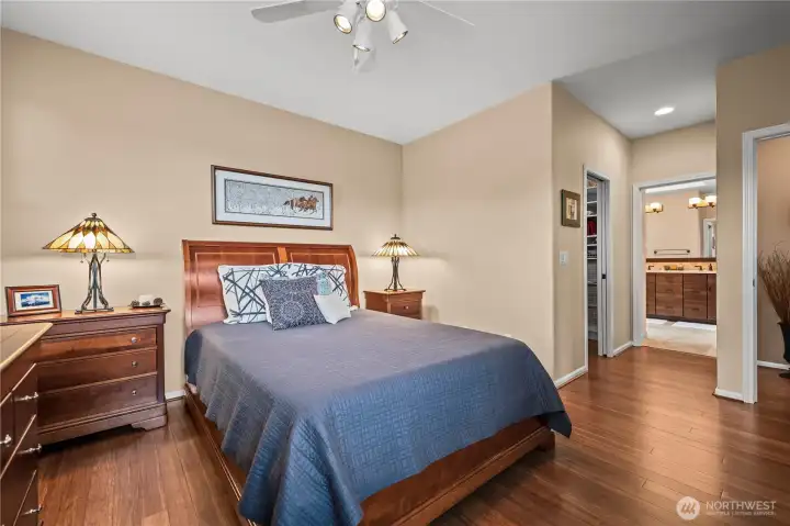 Hallway view showing walk-in closet and en suite bath.