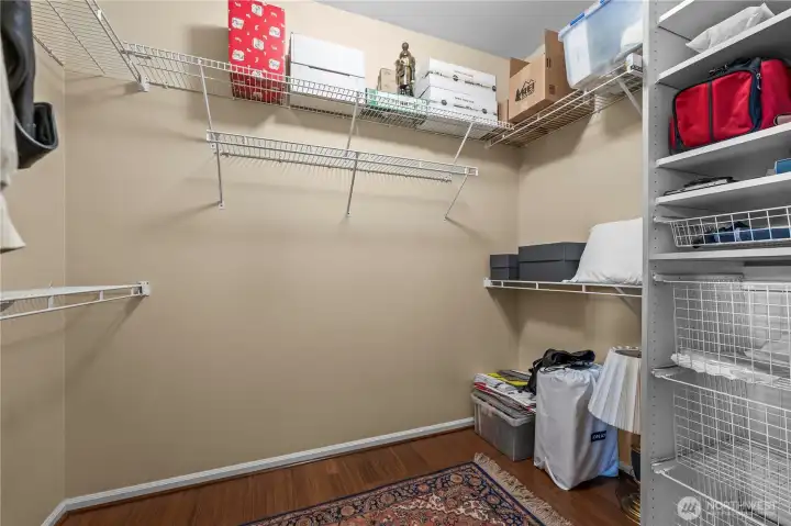 Large walk-in closet with built-in organizers.