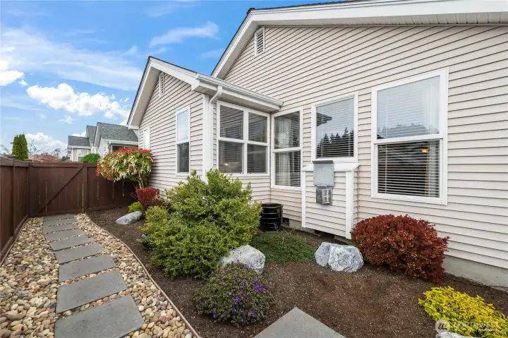 Professionally designed exterior landscaping with thoughtful updates. The new fireplace vent was streamlined to be less imposing.