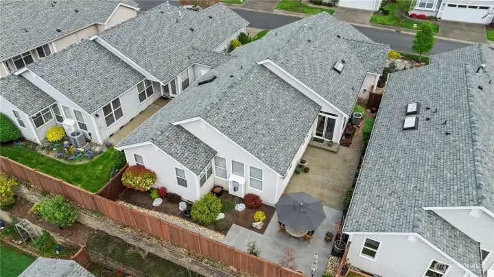 An aerial view showing the extended patio and low maintenance landscaping.