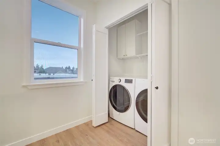 Washer/dryer convenient to the bedrooms on the upper level.