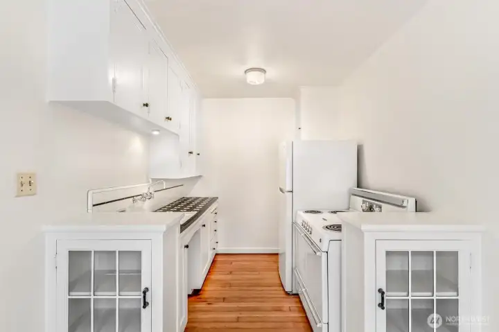 Lovingly updated to retain the original character of the period. New, energy efficient fridge, original retro stove, and original fir floors! Lovingly updated to retain the original character of the period. New, energy efficient fridge, original retro stove, and original fir floors!