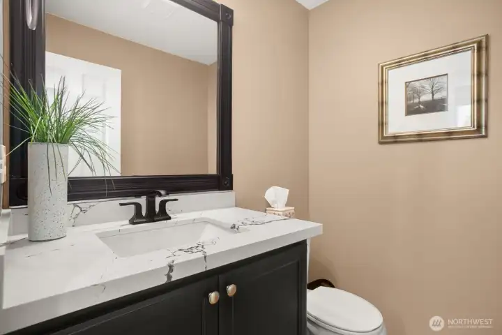 Main floor bathroom with quartz counters.