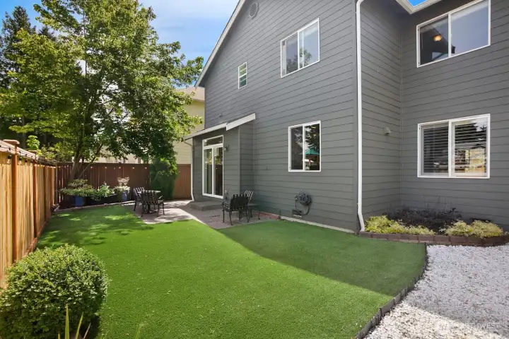 Good sized backyard with afternoon shade tree and lawn that is always green.
