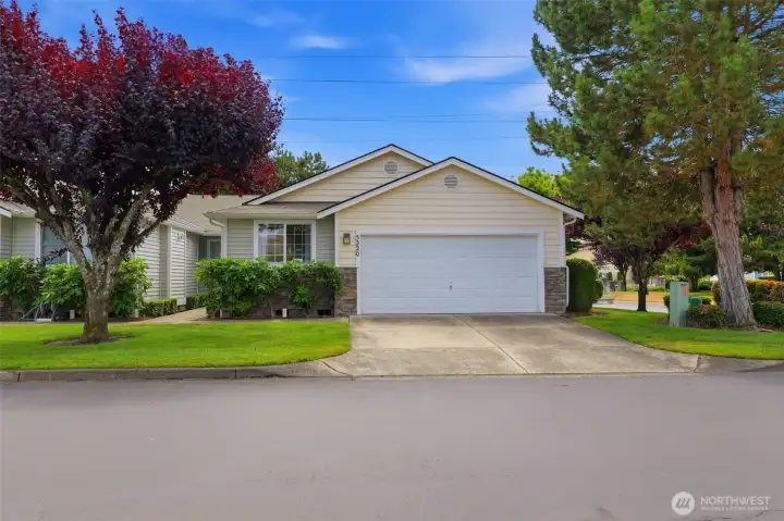 Welcome to 5220 77th St W #8 — single-level living with an attached 2-car garage in Lakewood's desirable gated Country Place community.