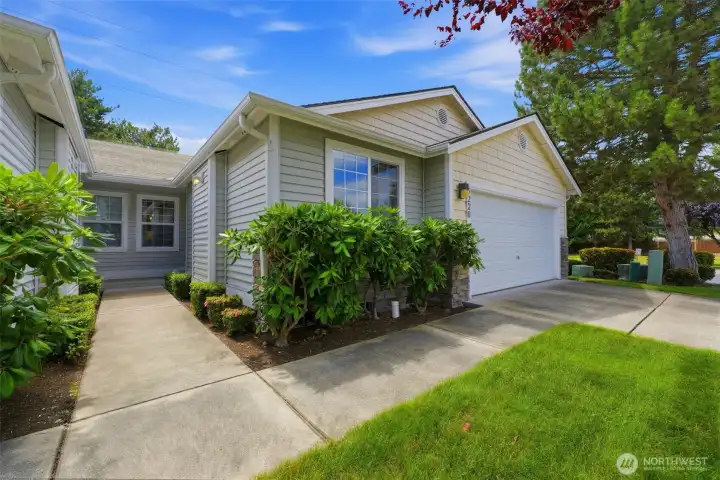 Crisp curb appeal with low-maintenance landscaping — the HOA covers exterior maintenance, roof, siding, and lawn care for just $200/month.