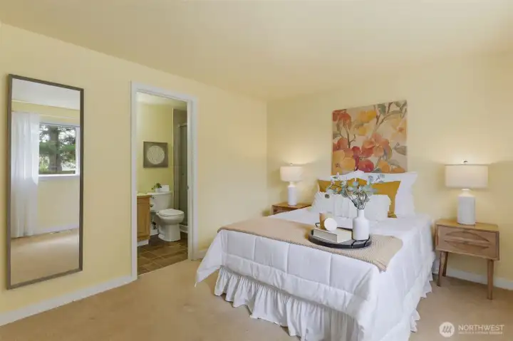 Relax in the serene primary suite with private en-suite bath — a true retreat, staged to perfection by Details.