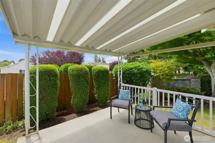 Private covered patio — the perfect spot for morning coffee or relaxed evening entertaining, rain or shine.