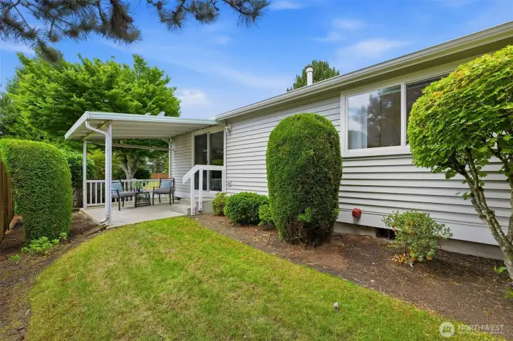 Low-maintenance yard and covered patio, with lawn care and landscaping handled by the HOA.